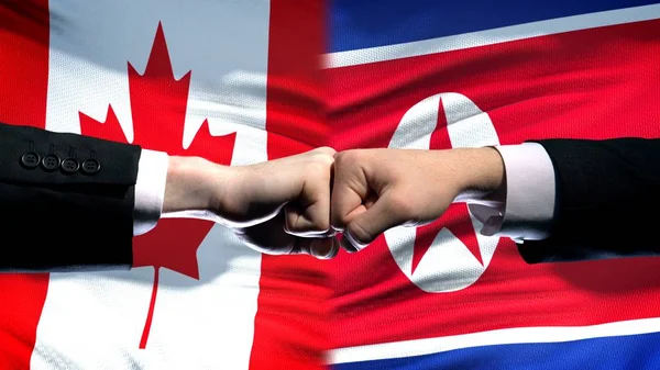Canada Noord Korea Conflict Internationale Betrekkingen Vuisten Vlag Achtergrond — Stockfoto