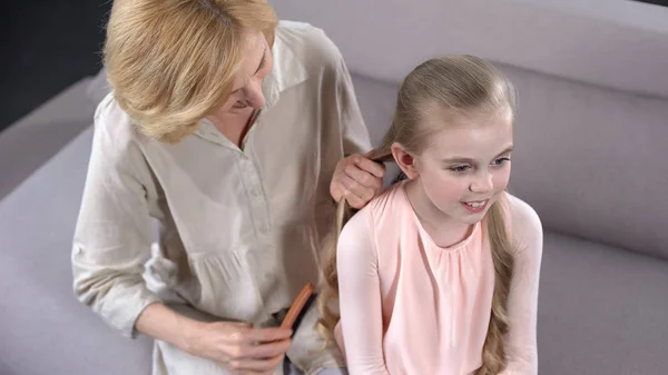 Elderly Nanny Combing Little Girl Hair Preparing Party Primary School — Stock Photo, Image