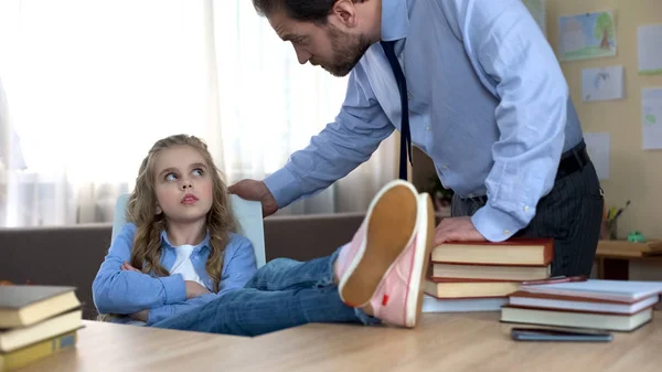 Mischievous Daughter Sitting Legs Table Ignoring Fathers Remarks — Stock Photo, Image