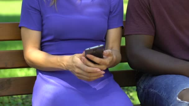 Mixed Race Couple Sitting Bench Park Using Smartphones Failed Date — Stock Video