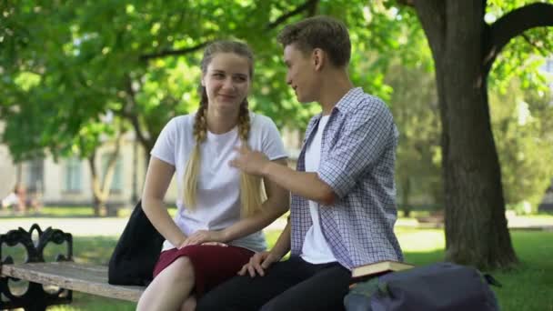 Laughing Friends Sitting Bench Park Telling Extremely Funny Story Joke Stock Video