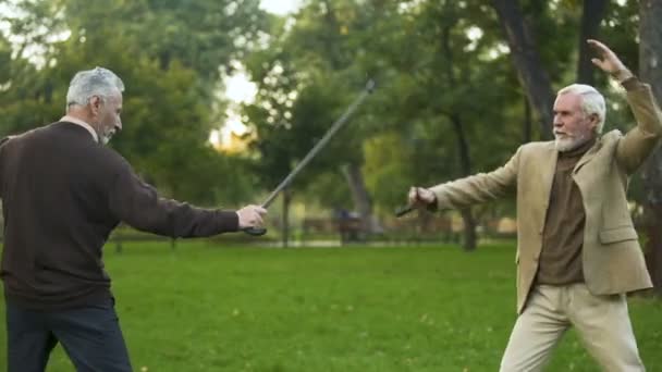 Funny Male Friends Fighting Walking Sticks Park Pretending Knights — Stock Video