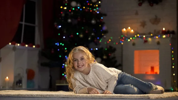 Nice Girl Lying Floor Glowing Xmas Decorations Rejoicing Christmas Eve — Stock Photo, Image