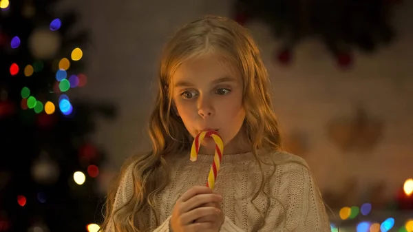 Girl Eating Sweet Tasty Mas Candy Dreaming Presents Celebration — Stock Photo, Image