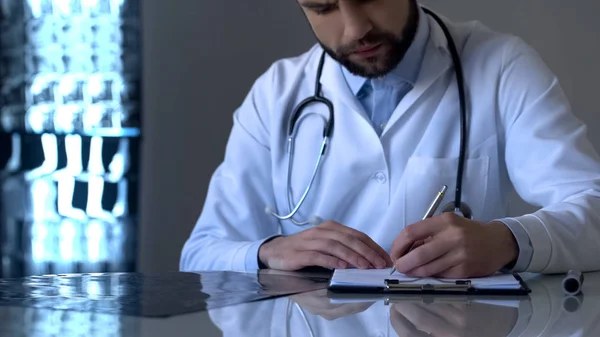 Experienced Doctor Examining Ray Writing Diagnosis Medical Form Health — Stock Photo, Image