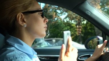 Successful business lady stuck in traffic jam, answering on phone call, traffic