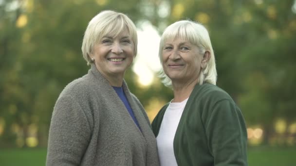 Smiling Senior Women Showing Thumbs Gesture Hugging Resting Park — Stock Video