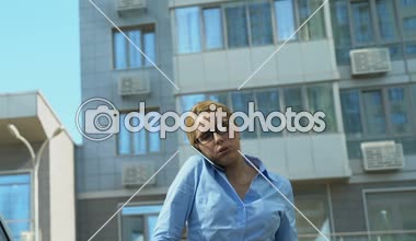 Male assistant giving auto keys to busy business woman hurrying to meeting