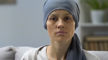 Portrait of pale woman sick with cancer, request for help, social protection