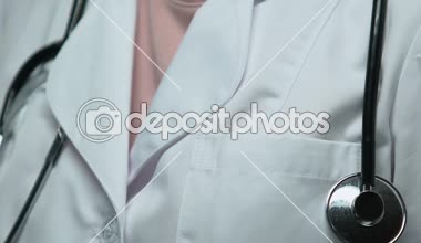 Doctor pins up pink ribbon, global fight against breast cancer, healthcare
