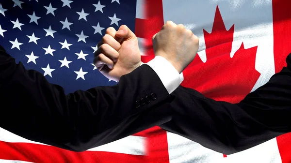 Ons Canada Confrontatie Landen Onenigheid Vuisten Vlag Achtergrond — Stockfoto