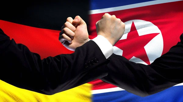 Alemanha Coreia Norte Confronto Punhos Fundo Bandeira Diplomacia — Fotografia de Stock