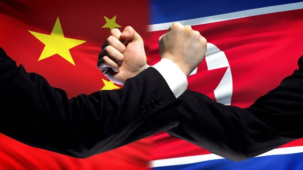 China Coreia Norte Punhos Confronto Fundo Bandeira Conflito Diplomático — Fotografia de Stock