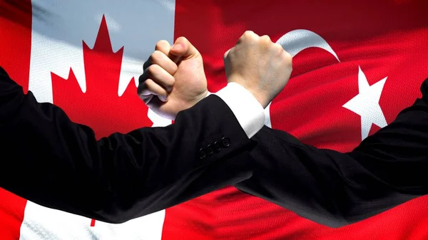 Canada Turkije Confrontatie Landen Onenigheid Vuisten Vlag Achtergrond — Stockfoto