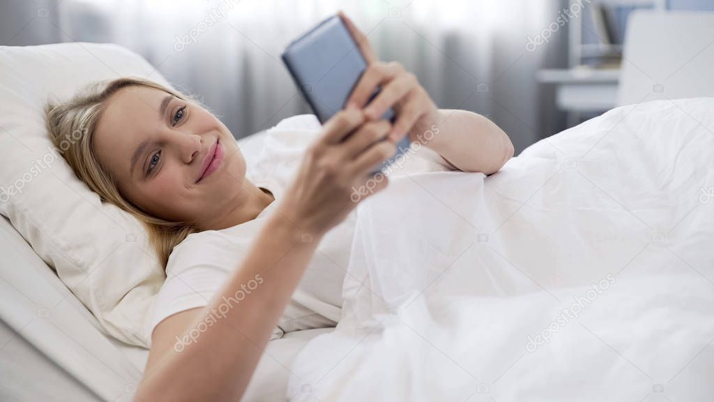 Smiling teenage girl communicating in social networks, first love, happy time