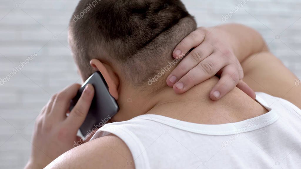 Fat man talking on phone and massaging neck, feeling pain, body care, medicine