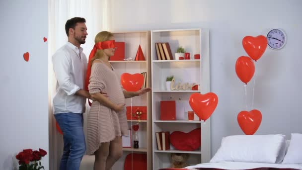 Husband Leading Blindfolded Red Ribbon Pregnant Lady Decorated Room — Stock Video