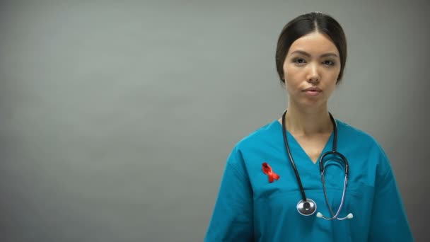 Asian Female Doctor Red Ribbon International Hiv Aids Awareness Sign — Stock Video