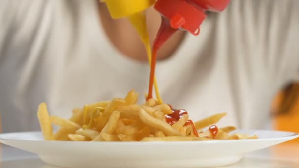 Female Hands Pouring Ketchup Mustard French Fries Extra Calorie Meal — Stock Video