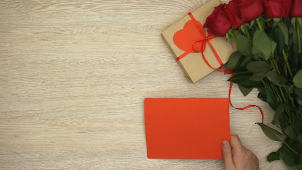 Hand Putting Red Greeting Card Gift Box Bunch Roses Valentines — Stock Video