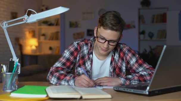 Diligent Teen Student Glasses Finishes Homework Looks Directly Camera — Stock Video