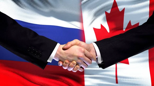 Venäjä Kanada Kädenpuristus Kansainvälinen Ystävyyshuippukokous Lippu Tausta — kuvapankkivalokuva