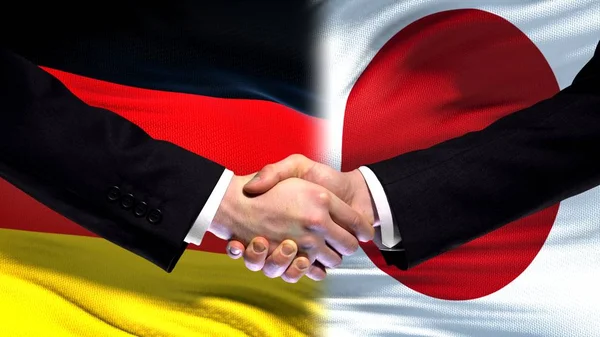 Tyskland Och Japan Handslag Internationella Vänskap Relationer Flagga Bakgrund — Stockfoto