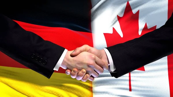 Duitsland Canada Handdruk Internationale Vriendschap Betrekkingen Vlag Achtergrond — Stockfoto