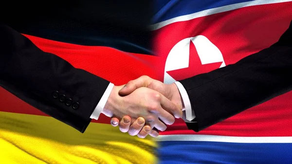 Duitsland Noord Korea Handdruk Internationale Vriendschap Vlag Achtergrond — Stockfoto