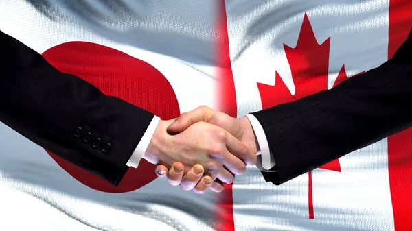 Japan Canada Handdruk Internationale Vriendschap Relaties Vlag Achtergrond — Stockfoto