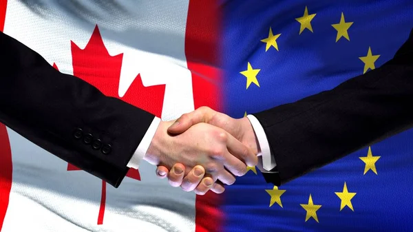 Kanada Euroopan Unioni Kädenpuristus Kansainvälinen Ystävyys Lipputausta — kuvapankkivalokuva