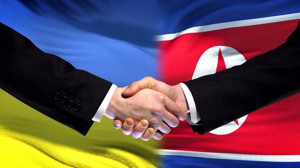 Ukraina Och Nordkorea Handslag Internationella Vänskap Flagga Bakgrund — Stockfoto