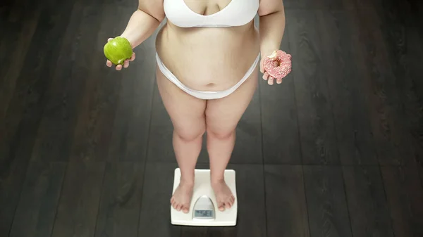 Chubby Woman Standing Scales Apple Bitten Donut Choosing Sweets — Stock Photo, Image