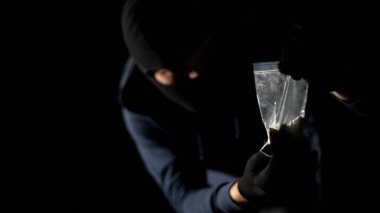 Addicted hooligan stealing drug package from dealers stash, robbery crime clipart