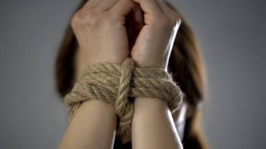 Woman hands tied up with rope, human trafficking, kidnapped woman, hostage clipart
