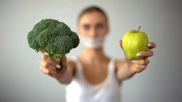 Anorexic Model Taped Mouth Holding Vegetables Concept Excessive Fasting — Stock Photo, Image