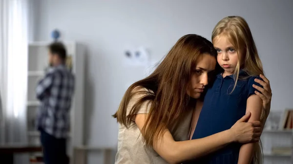 Mother Hugging Scared Daughter Protecting Girl Tyrant Father Home Abuse — Stock Photo, Image