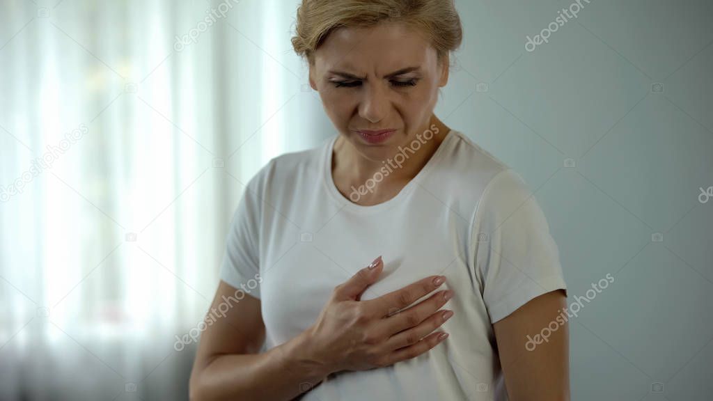 Middle aged woman feeling pain in breast, mammology problems, mastodynia