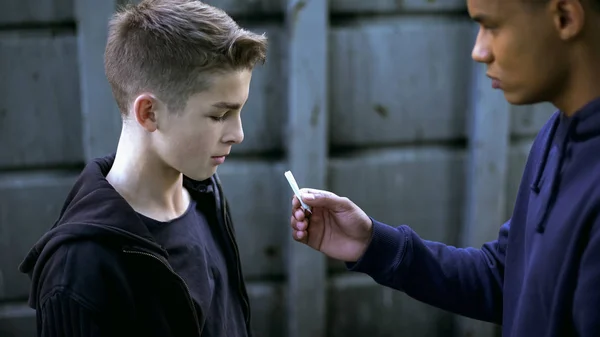 Drug Dealer Boy Treating Younger Friend Marijuana Cigarette Addiction — Stock Photo, Image