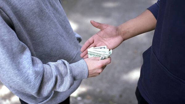 Robbery crime, senior student extorting cash from younger boy, school bullying