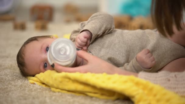 Cute Tiny Child Drinking Milk Formula Bottle Vitamin Complex Babies — Stock Video