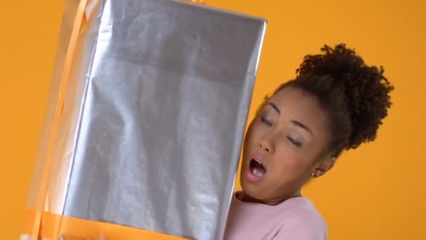 Surprised Black Woman Holding Heavy Gift Package Hands Holiday Present — Stock Video