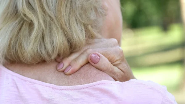 Mature Woman Massaging Numb Neck Shoulders Spine Injury Consequences — Stock Photo, Image