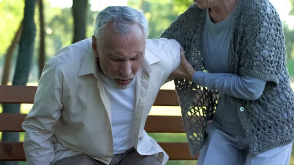 Old man has spine problems, vertebral hernia, caring wife supporting him, health — Stock Image Old Man Has Spine Problems Vertebral Hernia Caring Wife Supporting Stock Image