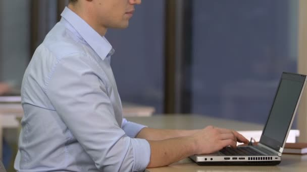 Overworked office employee feeling tired and exhausted while working on laptop — Stock Footage Overworked Office Employee Feeling Tired Exhausted While Working Laptop Royalty Free Stock Footage