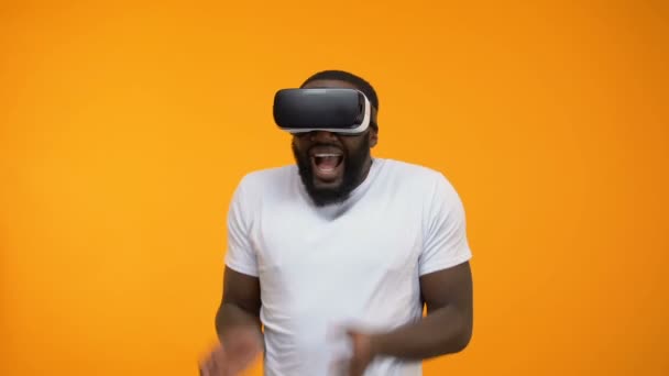 Scared African American Man Using Virtual Reality Headset Simulation Close — Stock Video