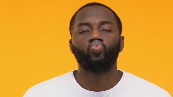 Afro American Man Sending Air Kiss Camera Winking Yellow Background — Stock Video