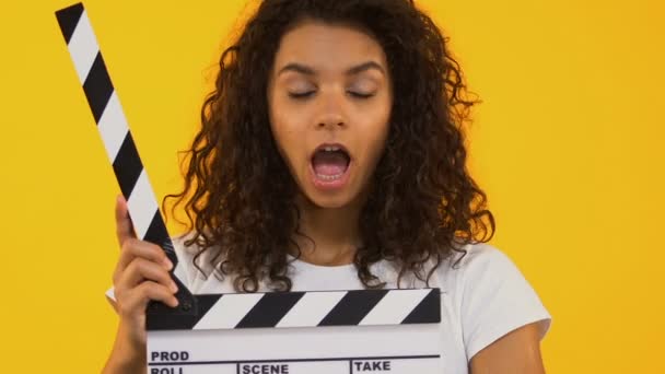 Astonished Girl Using Clapper Board Shocking Content Highest Rated Movie — Stock Video