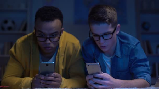 Multiracial Male Friends Surfing Net Late Night Gadget Addiction Eyesight — Stock Video