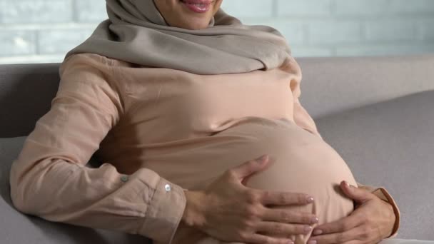 Happy Pregnant Arab Woman Stroking Belly Smiling Motherhood Healthcare — Stock Video